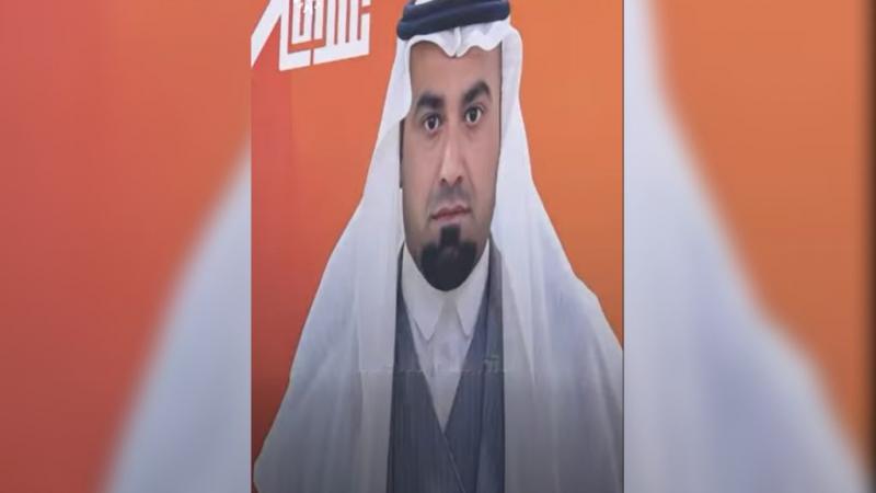 Az iraki nő választási plakátján nem a saját arca, hanem férjének a képe található.